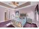 Primary bedroom with a queen bed, nightstand, and walk-in closet at 2271 Paraiso Ct, Englewood, FL 34224