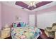 Bedroom with double bed, chair, and closet at 2271 Paraiso Ct, Englewood, FL 34224