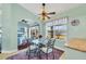 Bright breakfast nook with lake view and a small round table at 2271 Paraiso Ct, Englewood, FL 34224
