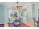 Breakfast nook with glass-top table and four chairs, offering a bright space at 2271 Paraiso Ct, Englewood, FL 34224