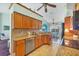 Kitchen boasts granite countertops, wood cabinets, and stainless steel appliances at 2271 Paraiso Ct, Englewood, FL 34224