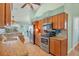 Galley-style kitchen with granite countertops and wood cabinets at 2271 Paraiso Ct, Englewood, FL 34224