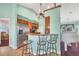 Kitchen with breakfast bar, stainless steel appliances, and light-colored cabinetry at 2271 Paraiso Ct, Englewood, FL 34224