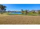Community pond with fountain and lush landscaping at 2271 Paraiso Ct, Englewood, FL 34224