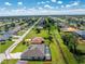 Aerial view of home, pool, and large lot at 35 Broadmoor Ln, Rotonda West, FL 33947