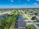 Aerial view of a house featuring a pool and screened enclosure at 35 Broadmoor Ln, Rotonda West, FL 33947