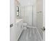Bathroom with white vanity, shower, and grey flooring at 35 Broadmoor Ln, Rotonda West, FL 33947