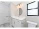Bathroom with white vanity, marble countertop and toilet at 35 Broadmoor Ln, Rotonda West, FL 33947