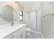 Bathroom with white vanity, marble countertop, and mosaic shower at 35 Broadmoor Ln, Rotonda West, FL 33947