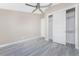 Spacious bedroom with ceiling fan and sliding door closet at 35 Broadmoor Ln, Rotonda West, FL 33947