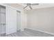 Bright bedroom with ceiling fan and a large closet at 35 Broadmoor Ln, Rotonda West, FL 33947