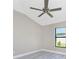 Bright bedroom with ceiling fan and grey vinyl flooring at 35 Broadmoor Ln, Rotonda West, FL 33947