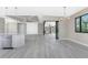 Open dining area with a view of the kitchen and sliding glass doors to the lanai at 35 Broadmoor Ln, Rotonda West, FL 33947
