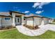 Beautiful new construction home with a paved walkway and landscaping at 35 Broadmoor Ln, Rotonda West, FL 33947