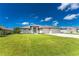 Inviting single-story home with a three-car garage and landscaped front yard at 35 Broadmoor Ln, Rotonda West, FL 33947
