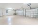Bright and spacious two-car garage, featuring epoxy flooring at 35 Broadmoor Ln, Rotonda West, FL 33947