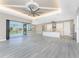 Open floor plan great room with kitchen, island, and pool view at 35 Broadmoor Ln, Rotonda West, FL 33947
