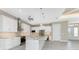 Modern kitchen with island, stainless steel appliances, and granite countertops at 35 Broadmoor Ln, Rotonda West, FL 33947