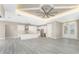 Open concept kitchen features white cabinets, granite countertops, and stainless steel appliances at 35 Broadmoor Ln, Rotonda West, FL 33947