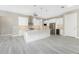 Modern kitchen with white shaker cabinets, granite island, and stainless steel appliances at 35 Broadmoor Ln, Rotonda West, FL 33947