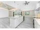 Spacious kitchen island with granite countertop and white cabinets at 35 Broadmoor Ln, Rotonda West, FL 33947