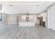 White kitchen with center island and stainless steel appliances at 35 Broadmoor Ln, Rotonda West, FL 33947