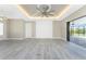 Bright and airy living room with sliding doors to outdoor area at 35 Broadmoor Ln, Rotonda West, FL 33947