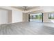 Spacious living room with sliding glass doors opening to the pool area at 35 Broadmoor Ln, Rotonda West, FL 33947