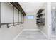 Large walk-in closet with custom shelving and hanging rods at 35 Broadmoor Ln, Rotonda West, FL 33947