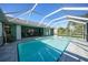 Inviting screened pool with spa and ample deck space at 360 Torrington St, Port Charlotte, FL 33954