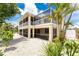 House with screened porch and tropical landscaping at 4151 N Beach Rd, Englewood, FL 34223