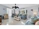 Bright living room featuring light blue sofas and coastal decor at 5194 Cooper Ter, Port Charlotte, FL 33981