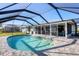 Enclosed kidney-shaped pool with canal views at 5194 Cooper Ter, Port Charlotte, FL 33981