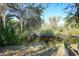 Peaceful waterfront view with lush vegetation and Spanish moss at 55 Bamboo Dr, Port Charlotte, FL 33954