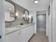 Modern bathroom with double vanity, marble countertop and large shower at 5856 Gasparilla Rd # M27, Boca Grande, FL 33921
