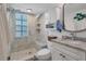 Clean bathroom with walk-in shower and built-in shelving at 5856 Gasparilla Rd # M27, Boca Grande, FL 33921