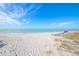 Relaxing beach area with lounge chairs at 5856 Gasparilla Rd # M27, Boca Grande, FL 33921