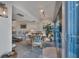 Bright dining area with table and chairs, offering water views at 5856 Gasparilla Rd # M27, Boca Grande, FL 33921