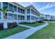 Building exterior with walkway and landscaping at 5856 Gasparilla Rd # M27, Boca Grande, FL 33921