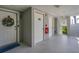 Clean and bright hallway with doors to units at 5856 Gasparilla Rd # M27, Boca Grande, FL 33921