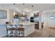 Modern kitchen with white cabinets and a large island at 5856 Gasparilla Rd # M27, Boca Grande, FL 33921