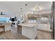 Modern white kitchen with quartz countertops and stainless steel appliances at 5856 Gasparilla Rd # M27, Boca Grande, FL 33921