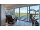 Home office with calming water views and comfortable seating at 5856 Gasparilla Rd # M27, Boca Grande, FL 33921