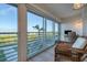 Relaxing office space with wicker chair and water views at 5856 Gasparilla Rd # M27, Boca Grande, FL 33921