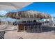 Relaxing tiki bar with seating for guests at 5856 Gasparilla Rd # M27, Boca Grande, FL 33921