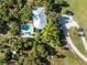 Home with pool and tropical landscaping at 6341 Biggs St, Englewood, FL 34224