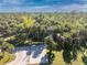 Aerial view of a home nestled in trees at 6341 Biggs St, Englewood, FL 34224