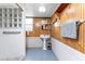 Clean bathroom with pedestal sink, tiled shower, and glass block window at 6341 Biggs St, Englewood, FL 34224