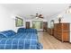 Bedroom with two twin beds, built-in bookcases, and plenty of natural light at 6341 Biggs St, Englewood, FL 34224