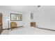 Spacious bedroom with a large bed, window, and a sitting chair at 6341 Biggs St, Englewood, FL 34224
